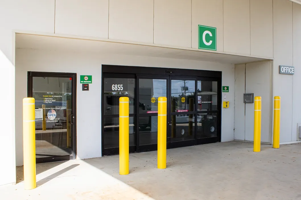 Secure storage facility entrance with keypad access and automatic sliding doors